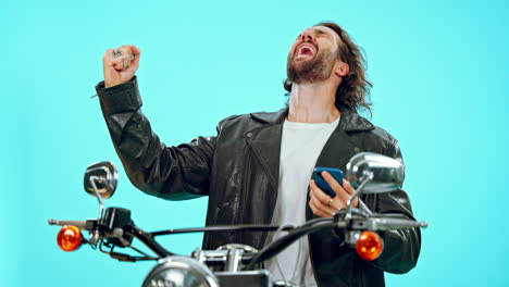Motorbike,-phone-and-man-winning-isolated-on-blue