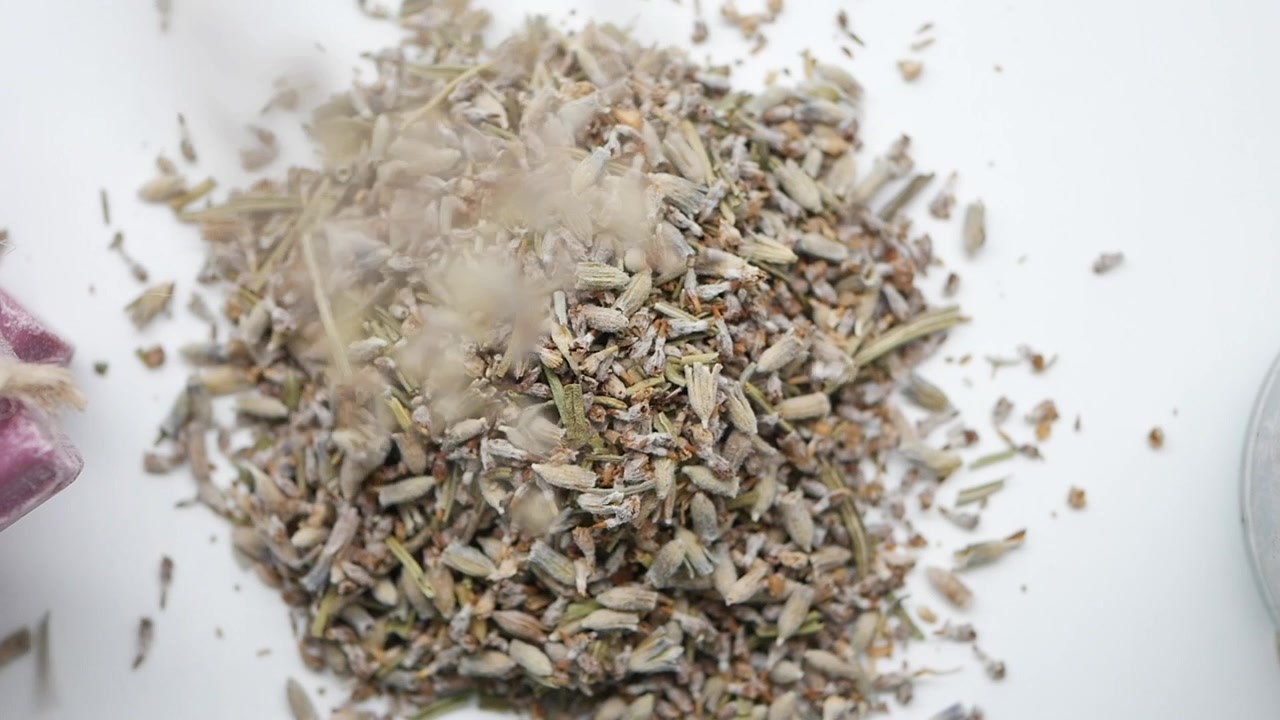 Dried Lavender Buds Falling onto a Pile