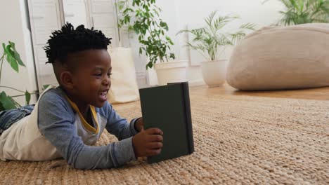 young boy reading at home