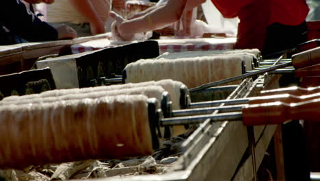 FOCUS-PULL---between-spinning-kurtoskalacs-at-a-Romanian-street-market