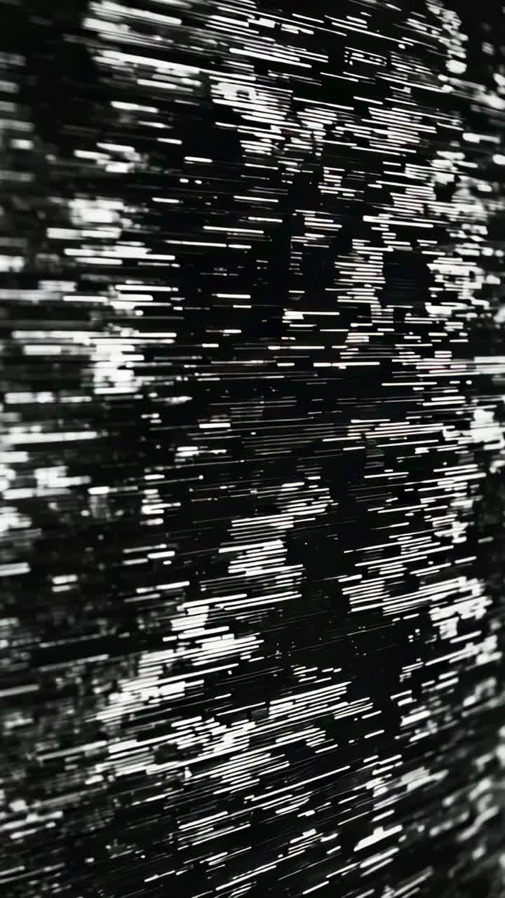 Vertical video: Playing screen animation, streaks collapsing into pixel grid and scanlines closeup