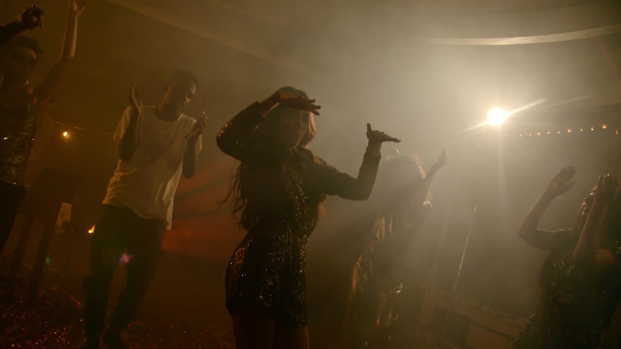 Overjoyed Young Woman Dancing to Music