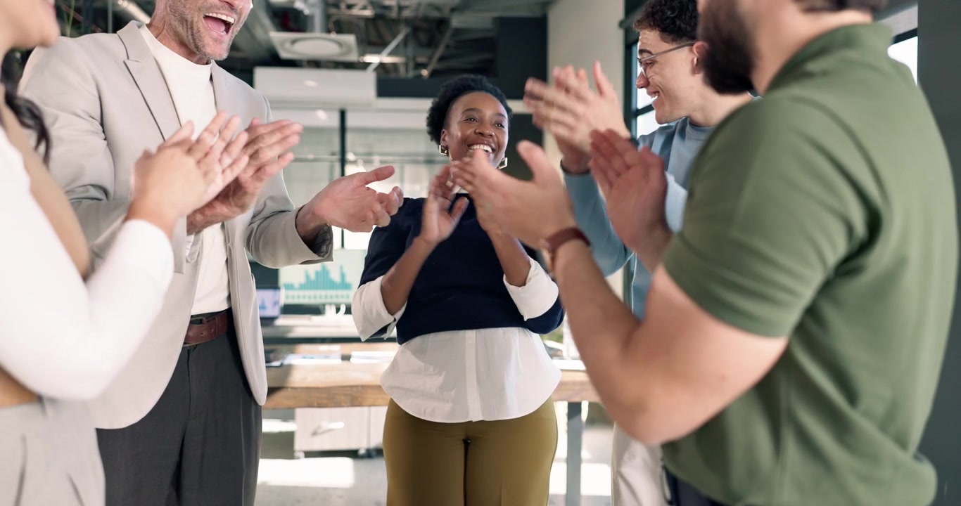 Diverse Business Team Celebrating Success with High Five and Clapping