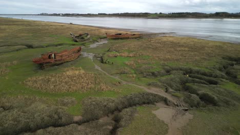 shipwrecks on salt marsh next to river wyre at fleetwood marshes nature reserve