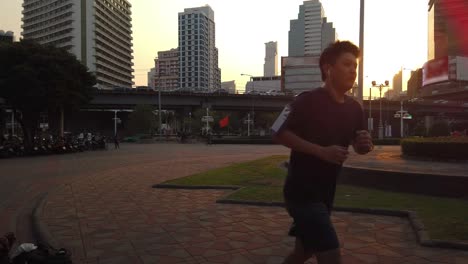 asian runner city run during sunset