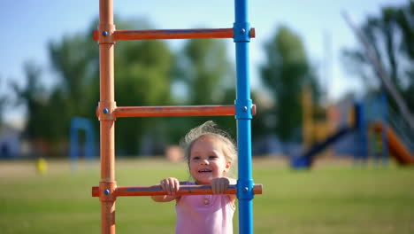 child climbing a ladder on a playground