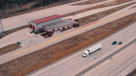 state troopers cars parked at the truck weigh station next to interstate