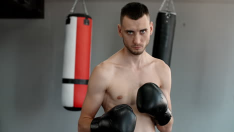 man in boxing gloves in gym