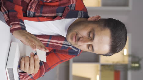 vertical video of the man who loves the photo in his hand.