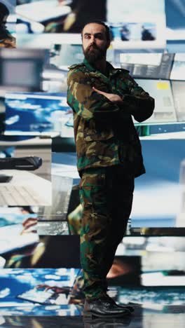 vertical video young veteran reviewing battlefield data in a high tech command center