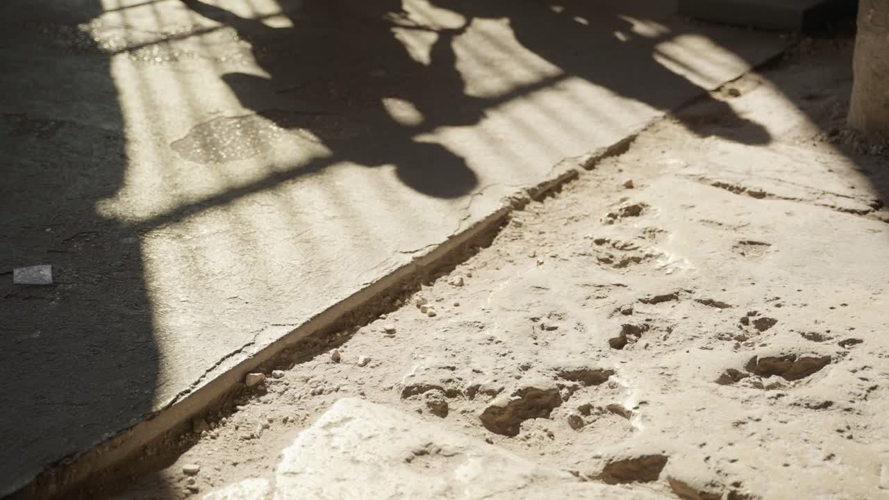 Crowd of people walking in heat wave on stone street as sun shines strong. Summer weather outdoors as visitors lining up on queue to see ancient ruins in European city. Multitudes walking outside