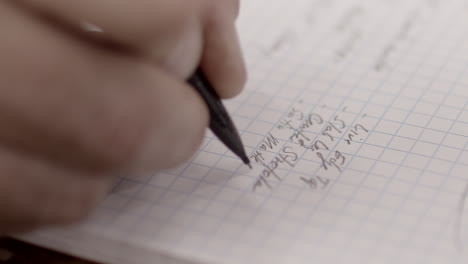 notes are written in a notebook with a mechanical pencil slow motion close up