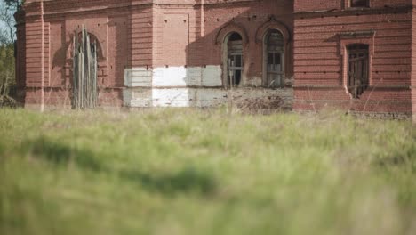 abandoned building in a grassy field