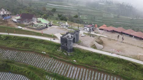 aerial view, beautiful scenery of the slopes of mount merbabu in negeri khayangan with the castle door icon-1