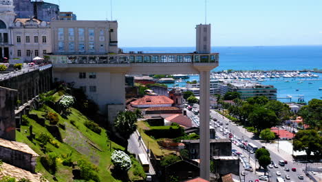 aerial view of elevador lacerda, the neighborhood around and the sea at background, salvador, bahia, brazil