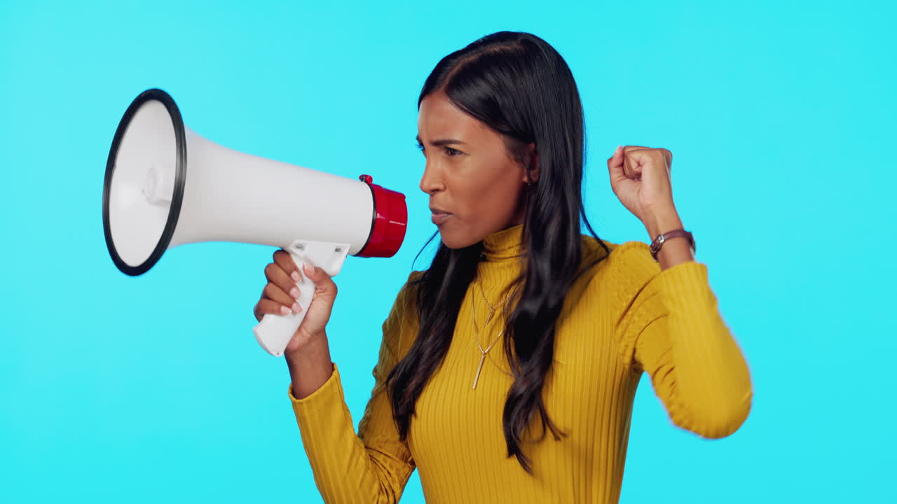 Woman, megaphone and protest shouting in studio