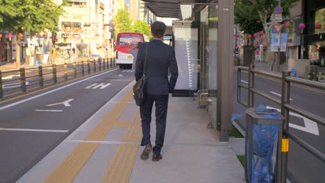 businessman walking to bus stop