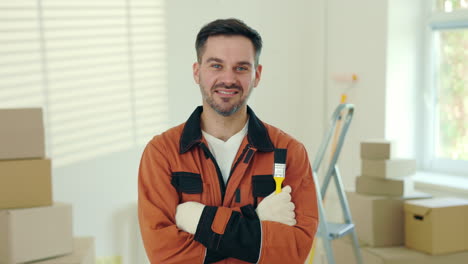 smiling worker in orange uniform