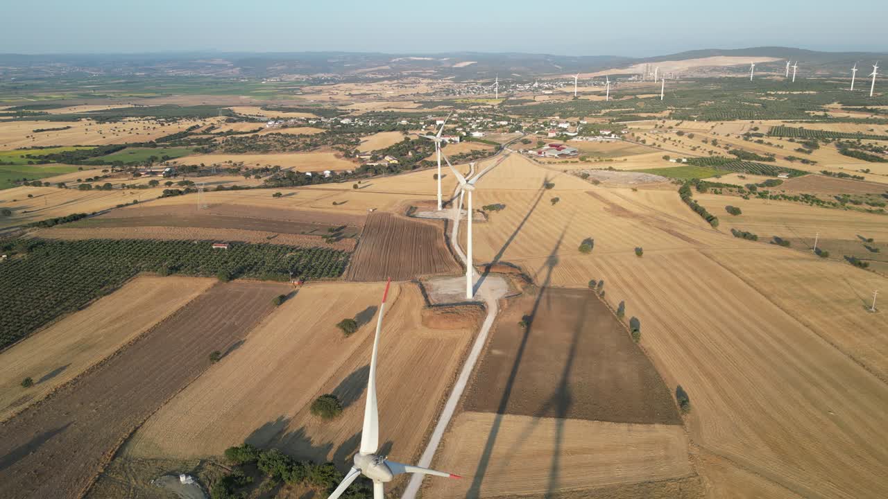 Aerial video of windmills at sunset