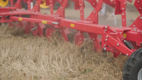 demonstration of agricultural machinery at an exhibition. tractors operate in the field, showcasing their capabilities and performance in action