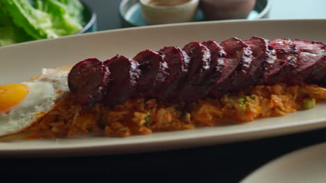 rice-and-meat-dish-being-served-inside-at-a-restaurant