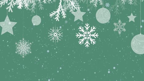 Animation-of-snow-and-christmas-decoration-moving-on-green-background