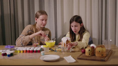 sisters decorating easter treats