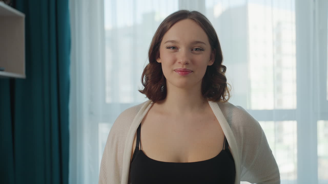 FullBody Twirl Of Caucasian Woman In Living Room, Morning Light Through Window, Cardigan And Denim Movement Convey Playful Energy And Carefree Mood, Spontaneous Home Dance And Expressive Rhythm