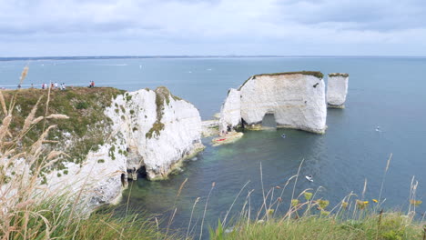 kayaks kayaking near the coast of old harry rocks sea stacks uk cliffs