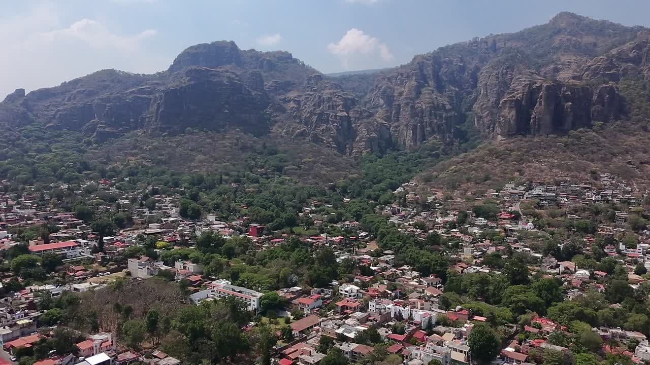 Aerial shot of the holy mountains of Tepoztlán, Mexico, on a bright day