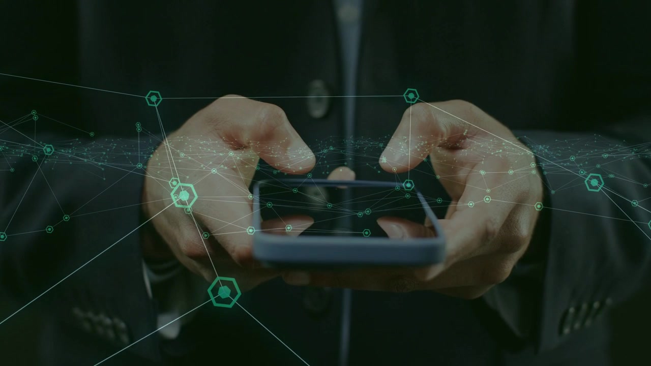 Businessman tapping and swiping smartphone while initiating teal network nodes overlaying tech app