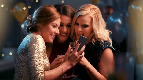 three friends enjoying a night out at a party