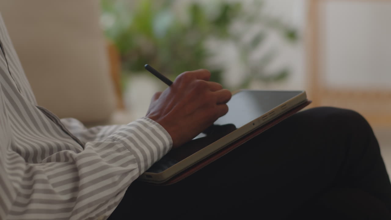 Patient Talking with Psychologist Making Notes on Tablet Computer