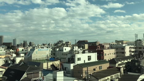 a view from the bullet train heading to osaka, japan