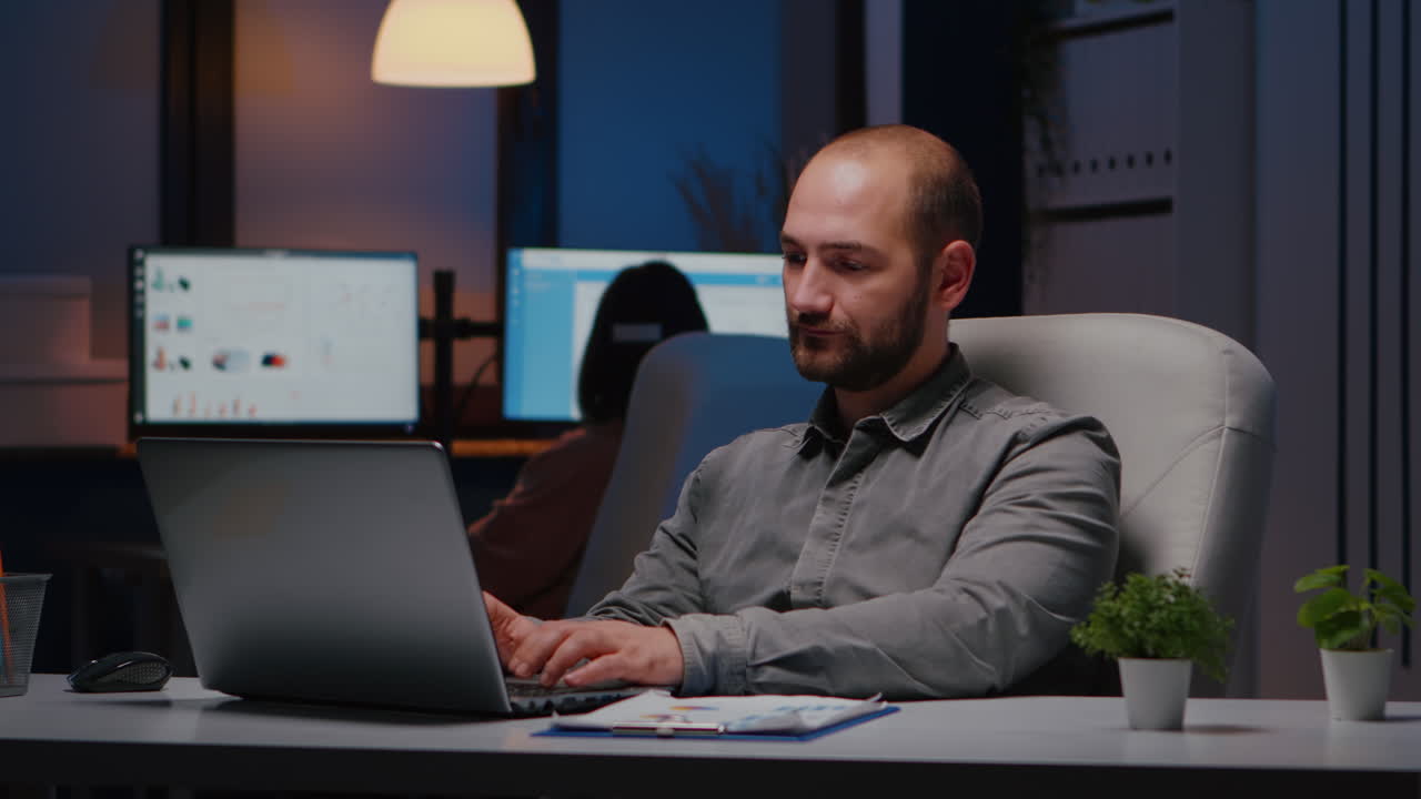 Portrait of businessman working on laptop computer planning financial strategy