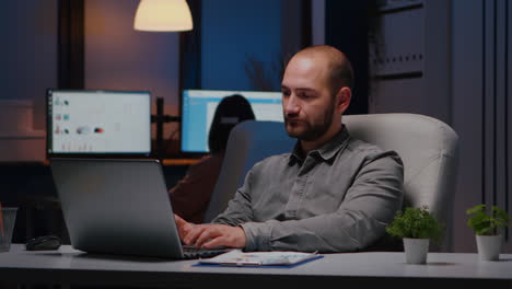 portrait of businessman working on laptop computer planning financial strategy