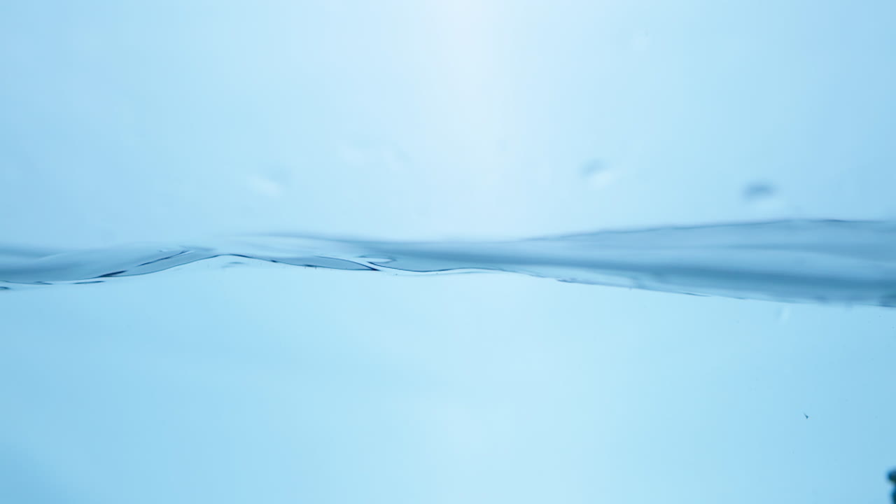 Charming close-up of water waves in motion, reflecting the tranquility and purity associated with natural hydration.