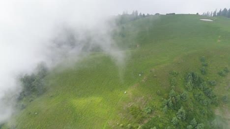 4k drone view of kuna dana peak where mountains embrace the clouds