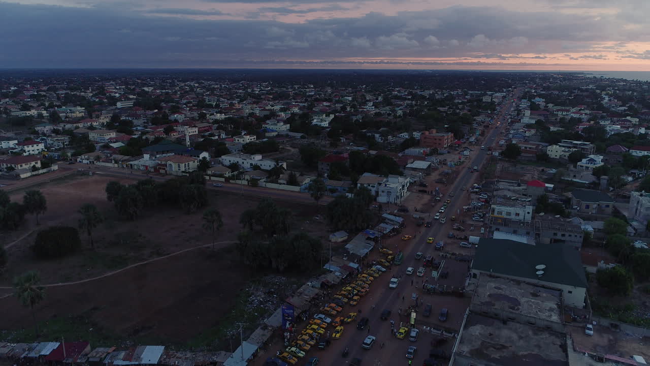 Aerial view of Senegambia Highway and the Coastal Road in The Gambia Africa during twilight sunset cloudy skies.