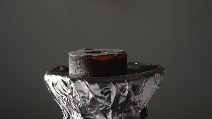 hookah putting coal buring red on hookah