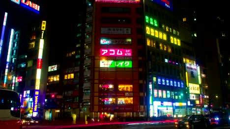 night lapse with japanese neons at shinjuku south side wide shot tilt up