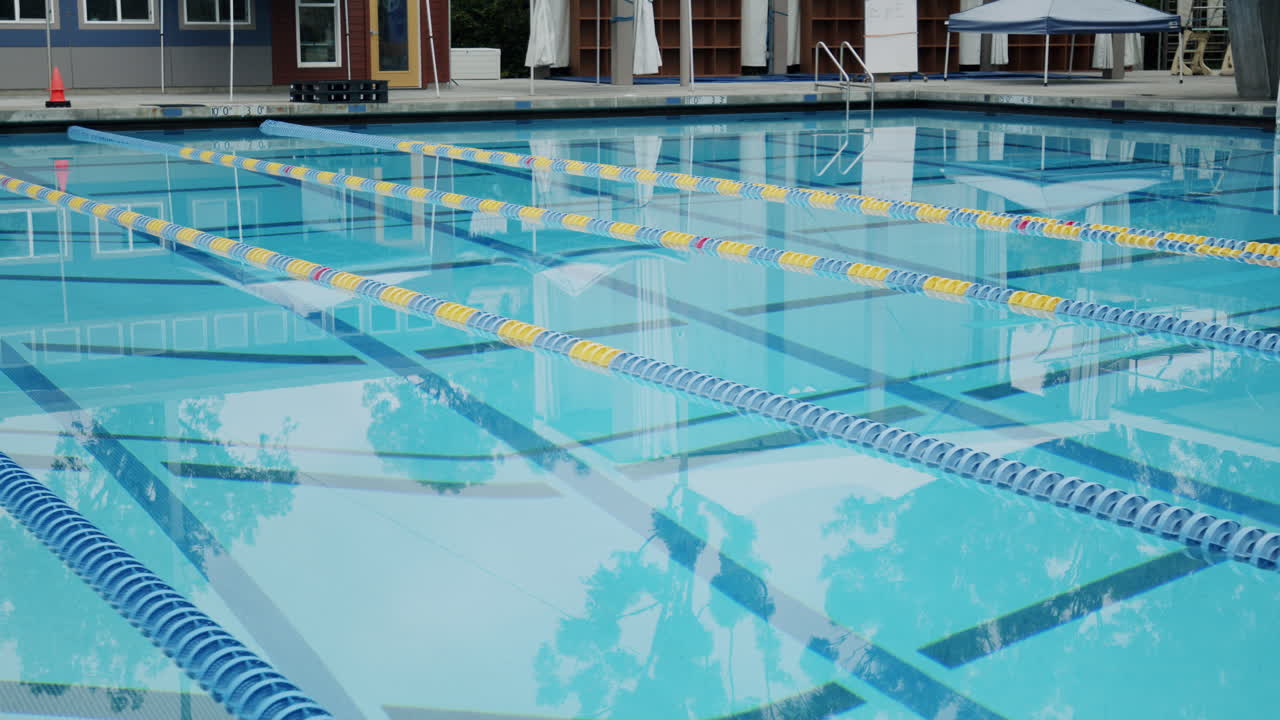 An empty swimming pool with lane markers