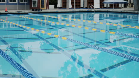 an empty swimming pool with lane markers