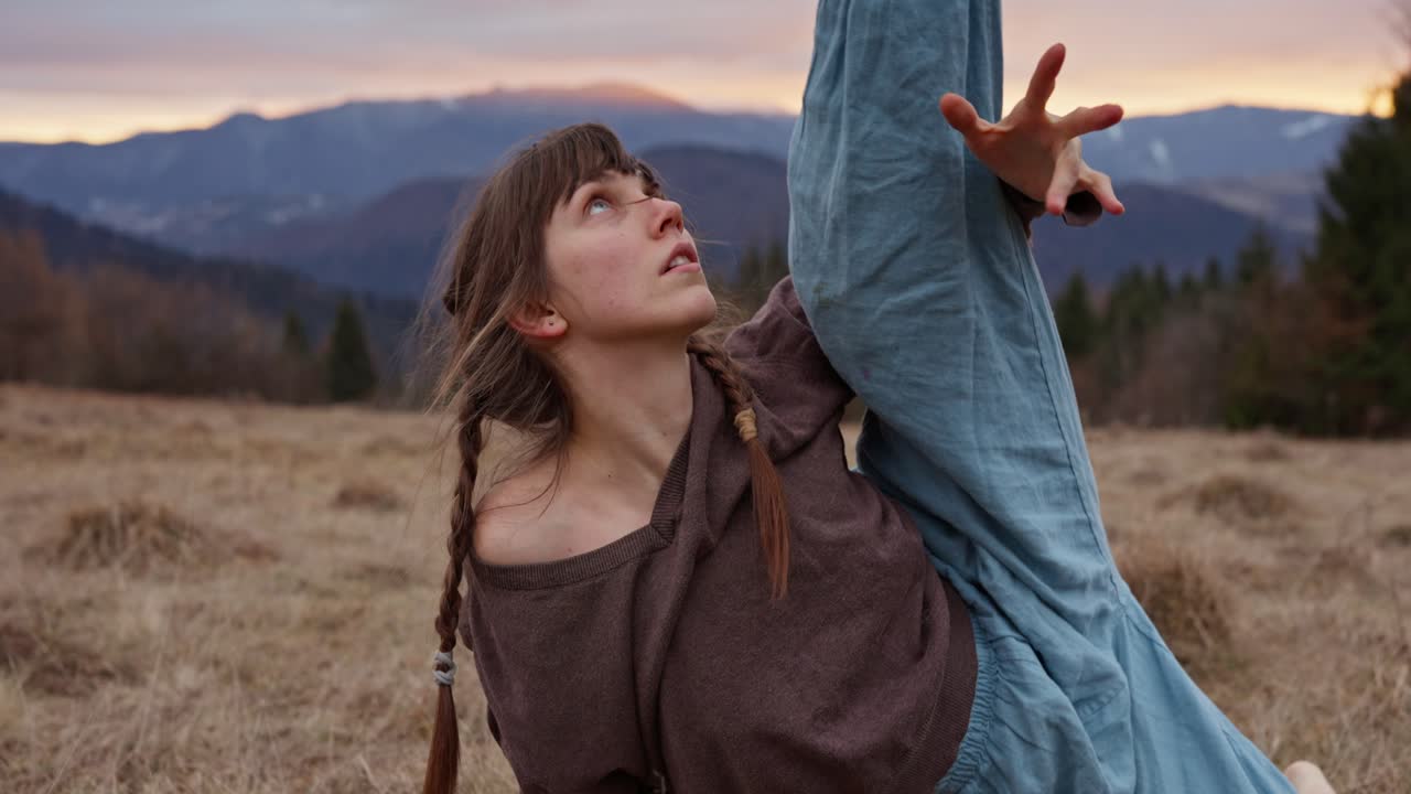 Woman Dancing in Nature at Sunset