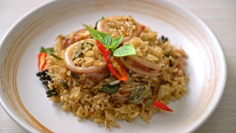 homemade basil and spicy herb fried rice with squid or octopus - asian food style