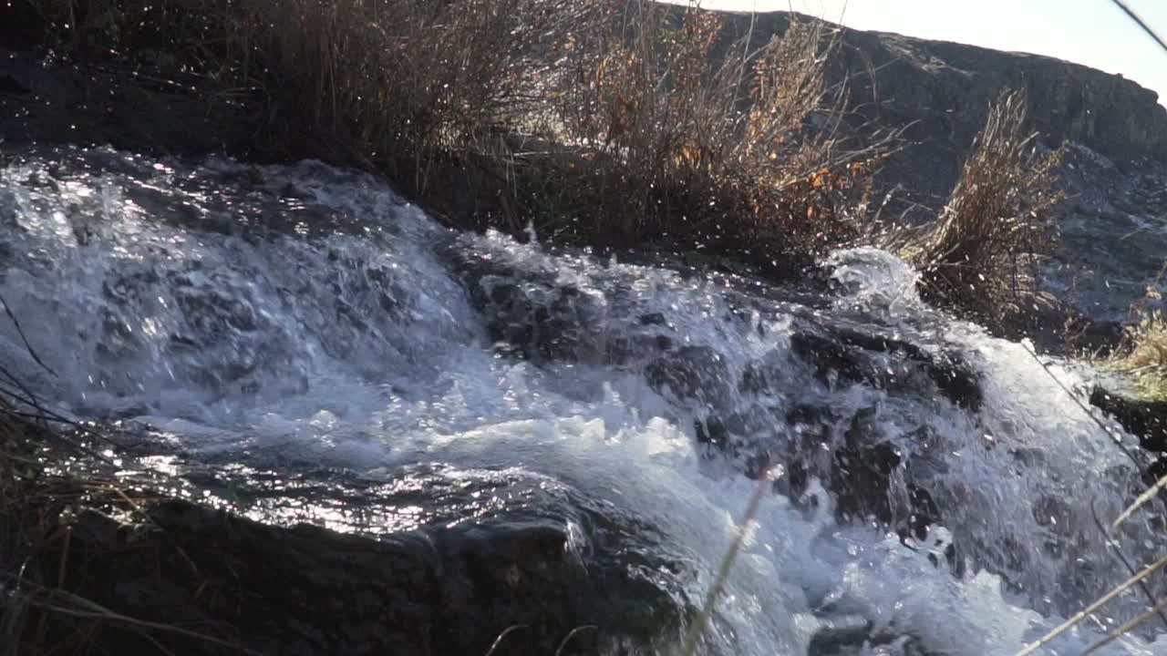 top of a waterfall. stream of water