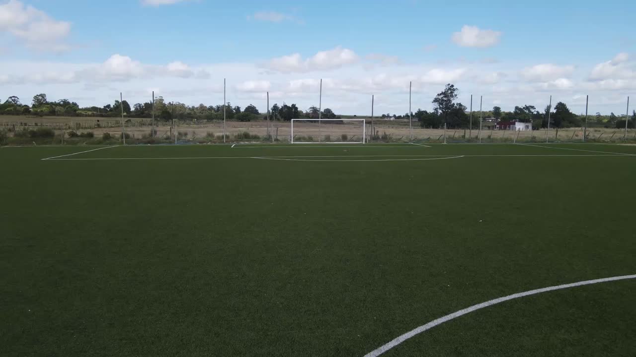 Multiple views of a vibrant green synthetic turf soccer field, showcasing its various angles and surrounding landscape