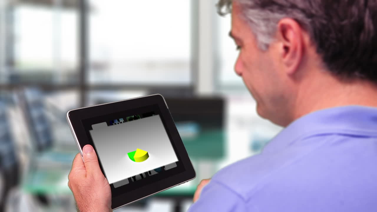 Man using tablet pc to view piechart