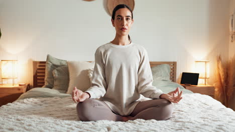 woman meditating in bed