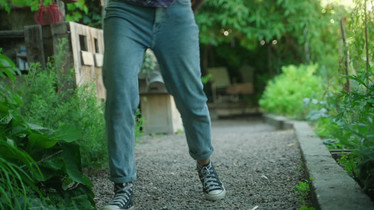 Happy woman spins on spot out of joy and dances
